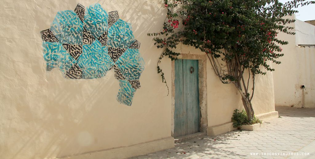 blue and green calligraphic graffiti Tunisia Djerba